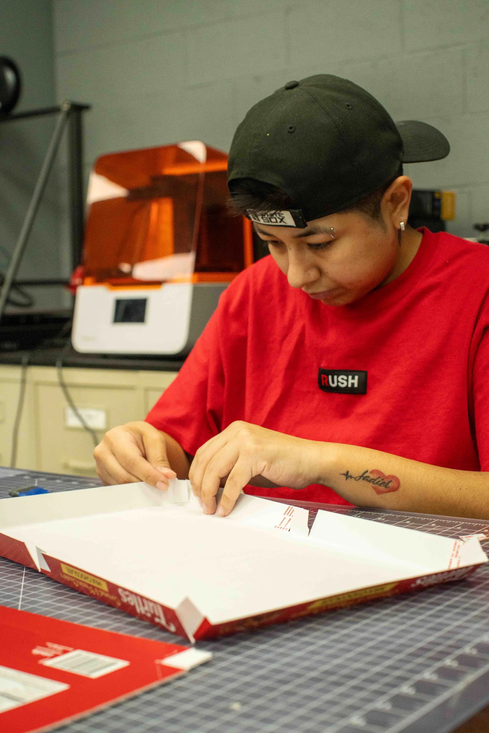 Folding the tray of a Turtles box by hand